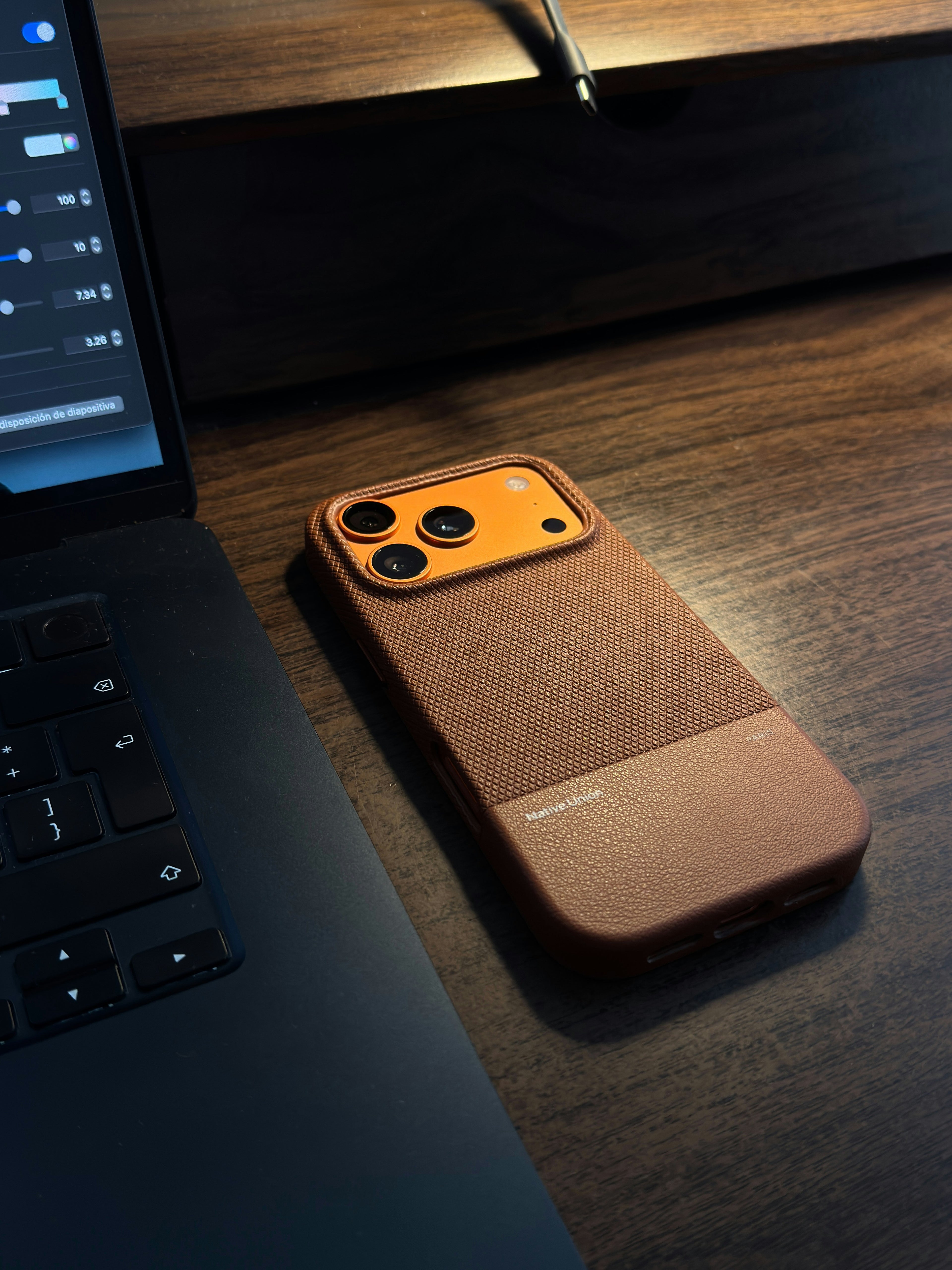 iPhone 16 Pro in a navy blue silicone case with MagSafe compatibility